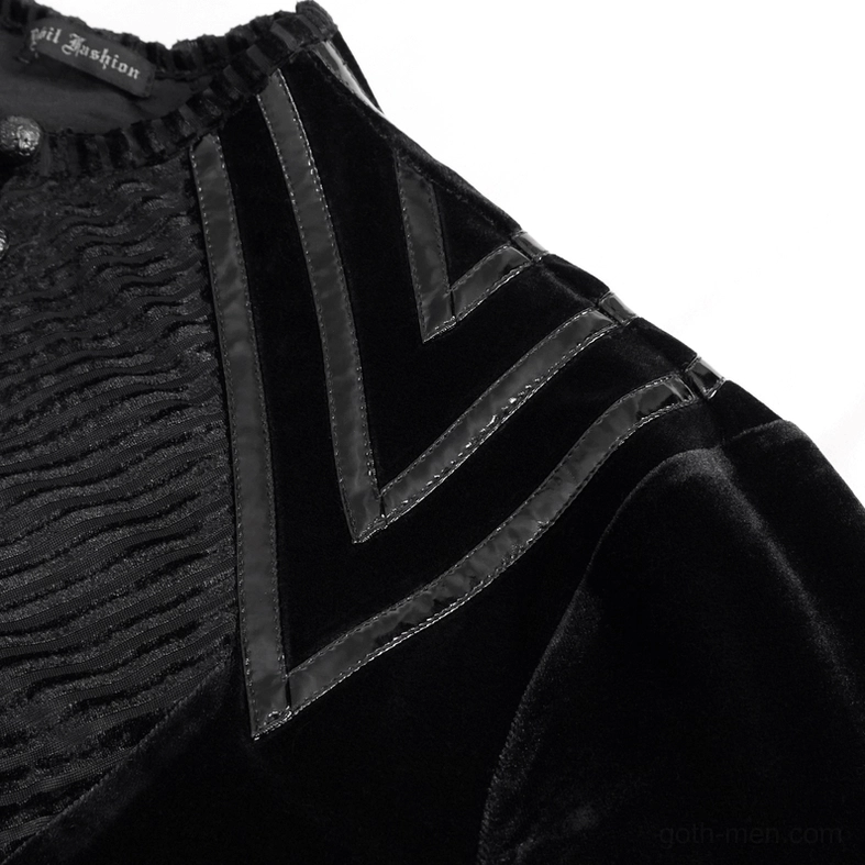 Close-up side view of black velvet gothic top shoulder showing leather chevron trim and textured velvet fabric