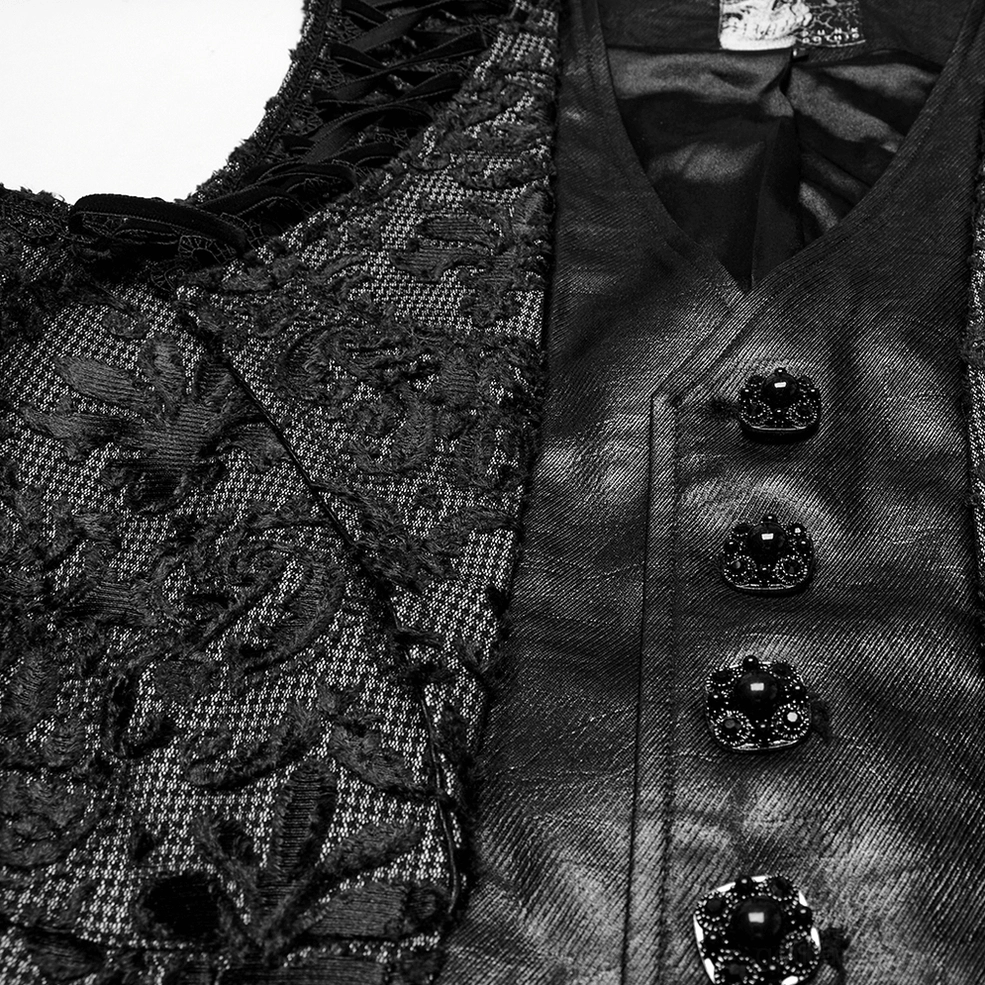 Close-up of black damask waistcoat front placket with faux leather strip and ornate brocade overlay