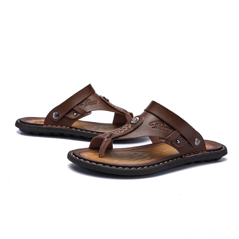 Dark brown gothic microfiber sandals with metal rivets and embossed branding - front view