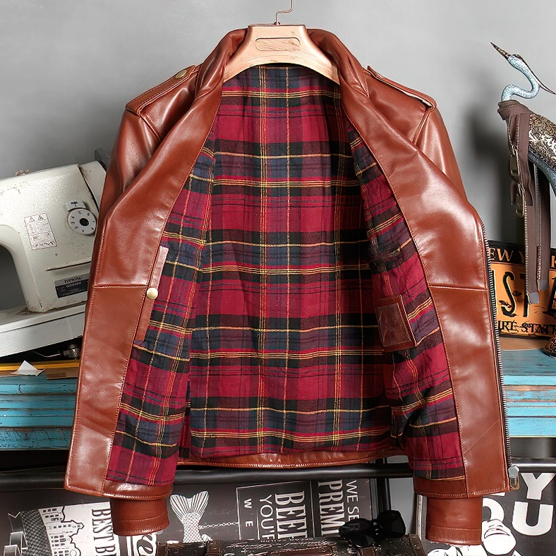 Brown leather moto jacket interior lining featuring red tartan plaid detail and full cotton lining