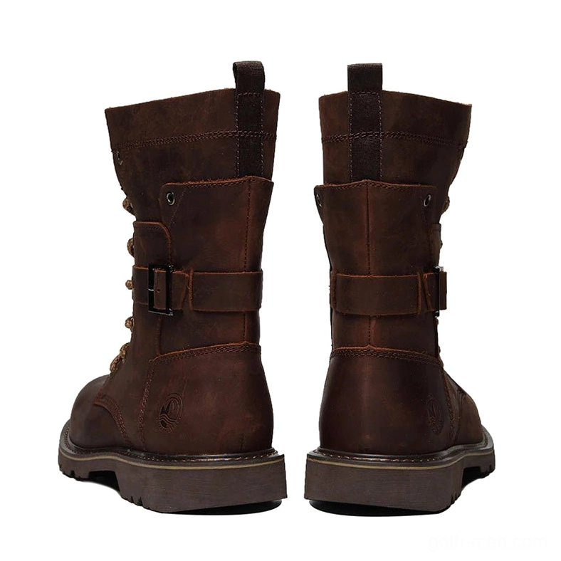 Pair of brown weathered leather motorcycle boots rear view showing buckle straps, heel pull tabs, and aged texture
