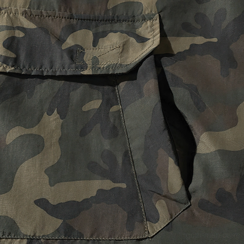 Oversized camo gothic military hoodie layering demonstration with alternative fashion styling