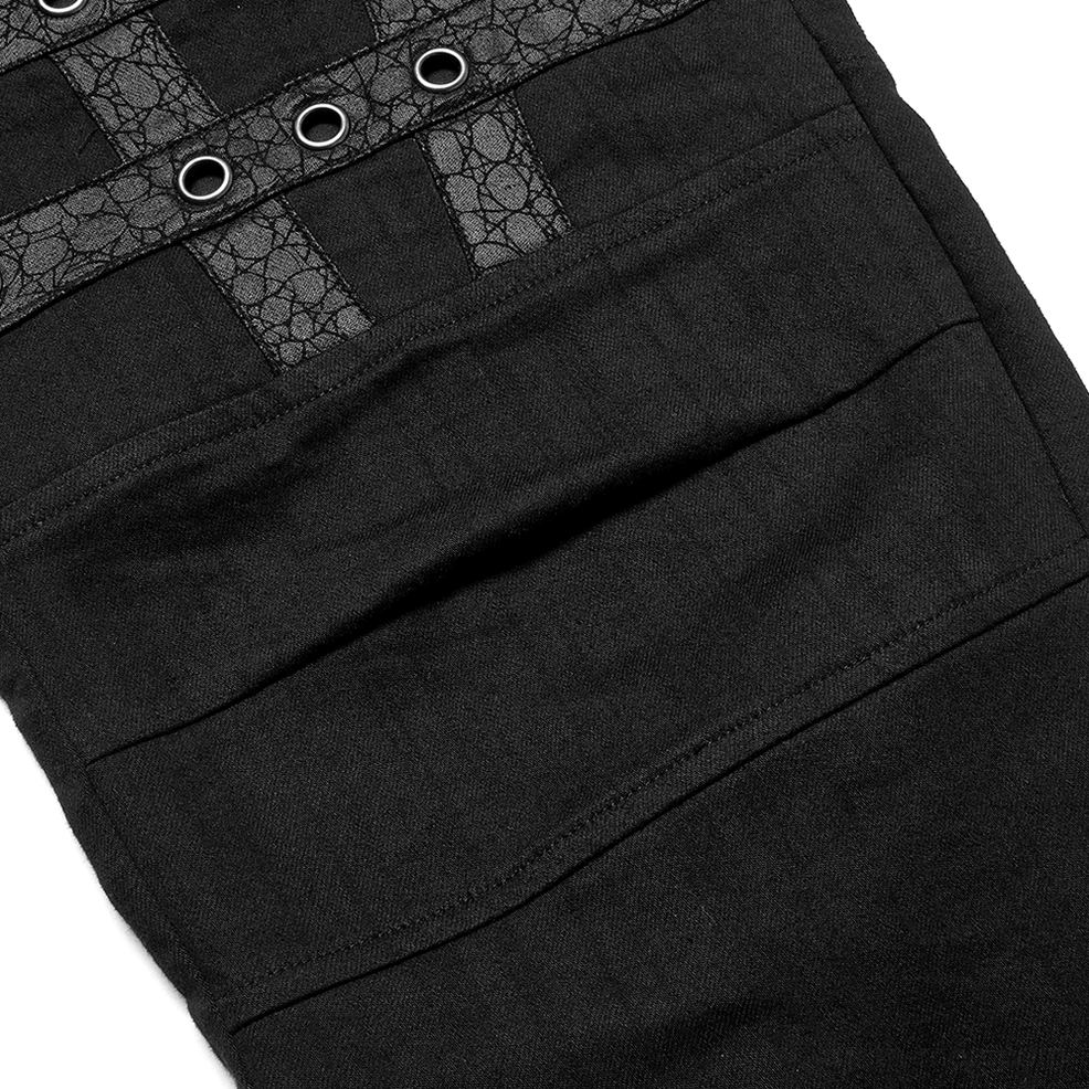 Close-up fabric detail of black gothic cargo pants showing textured faux leather straps and metal round grommets