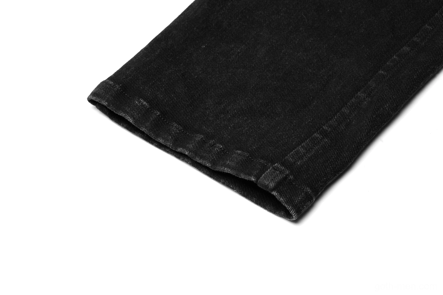 Close-up of hem and tapered trouser cuff with precision stitched seam construction