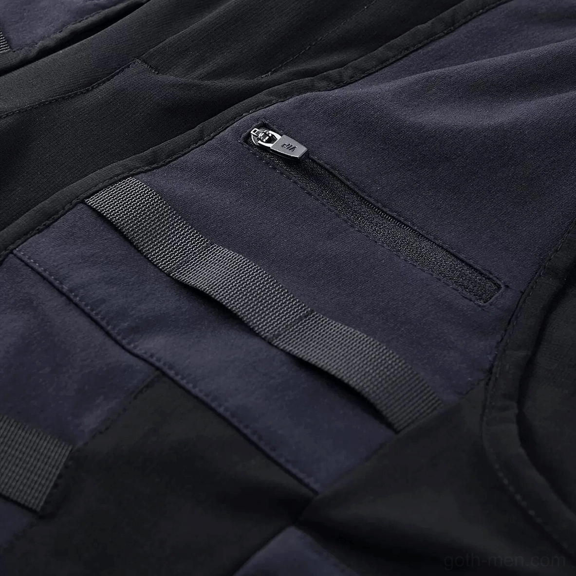 Cargo shorts zipper pocket detail - metal zipper puller with webbing securing strap