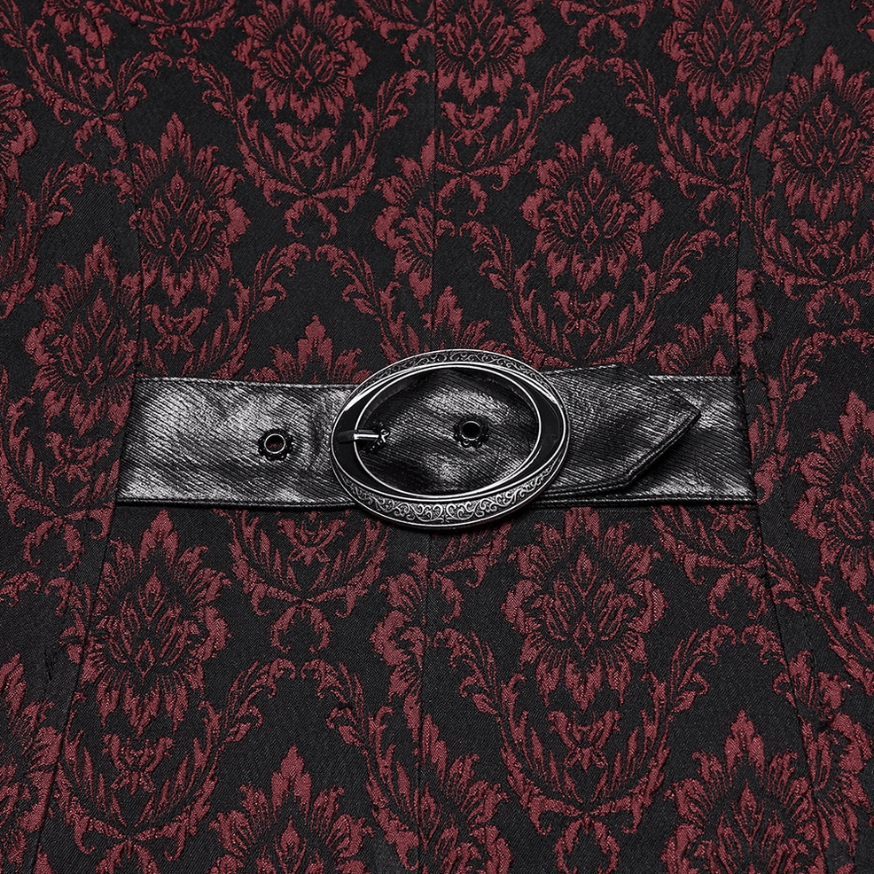 Back waist belt detail showing oval metal buckle and faux leather strap on damask pattern
