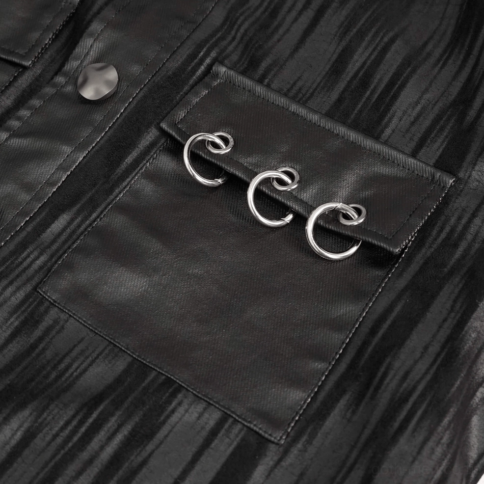 Crinkled black leather texture and metal hardware close-up of gothic punk jacket