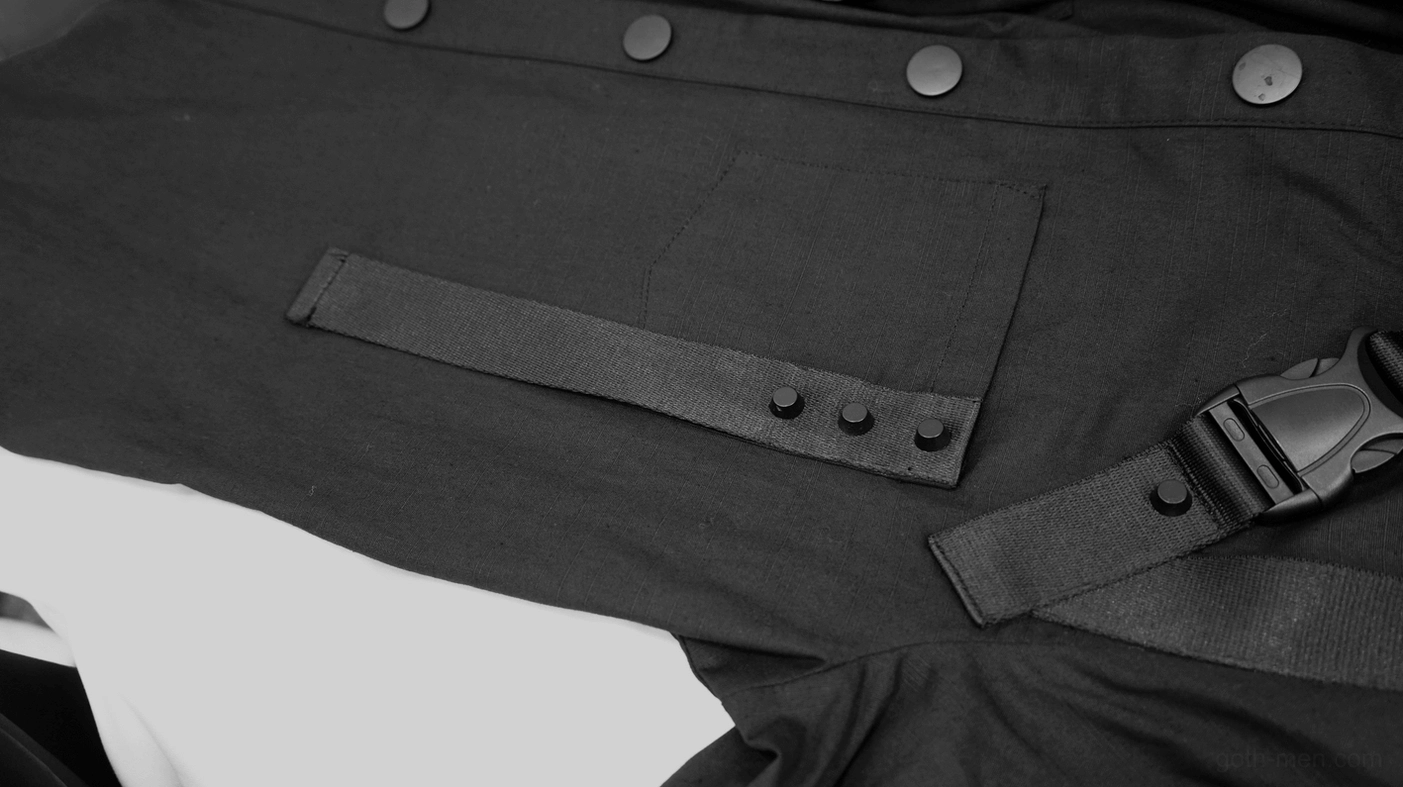 Close-up of gothic tactical shirt pocket and adjustable webbing strap with snap buttons