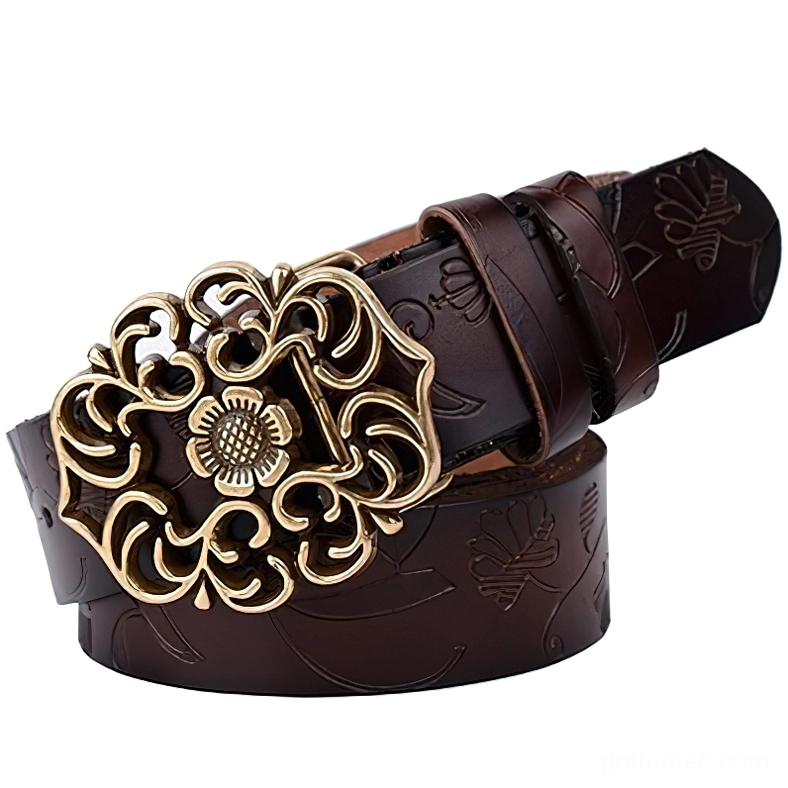 Dark brown leather gothic waistbelt with embossed floral motifs and antique bronze flower pin buckle, flat lay