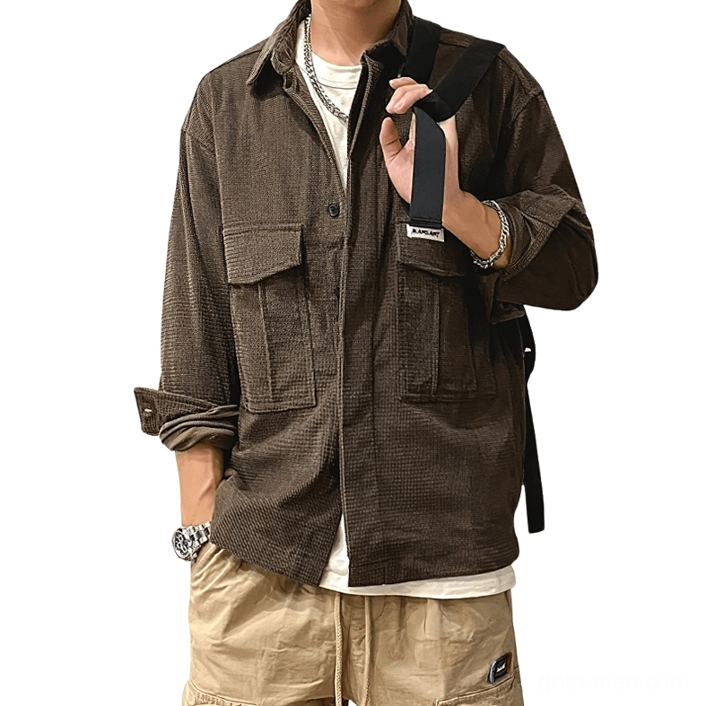 Dark brown waffle cord oversized gothic cargo shirt front view on male model, displaying full-length sleeves, button closure, and structured cargo pockets for alternative fashion styling