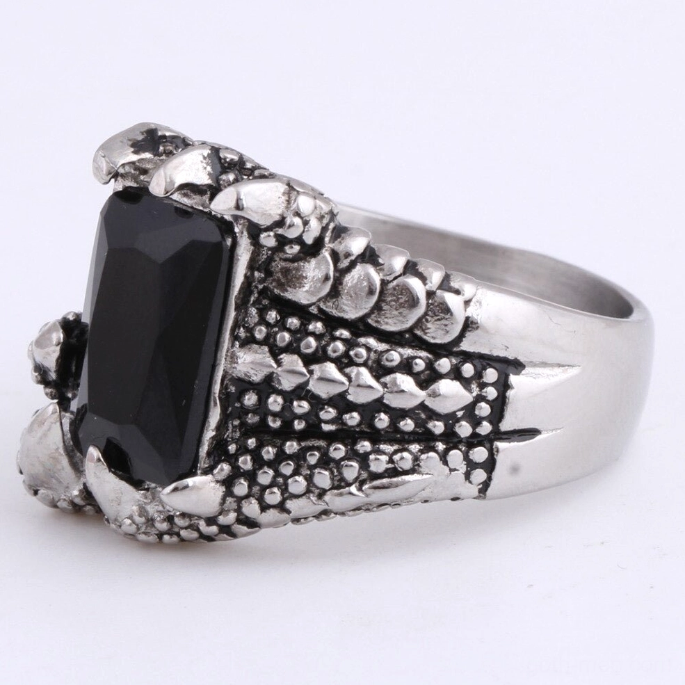 Side profile of dragon claw gothic ring showing gem depth and smooth inner band, left view