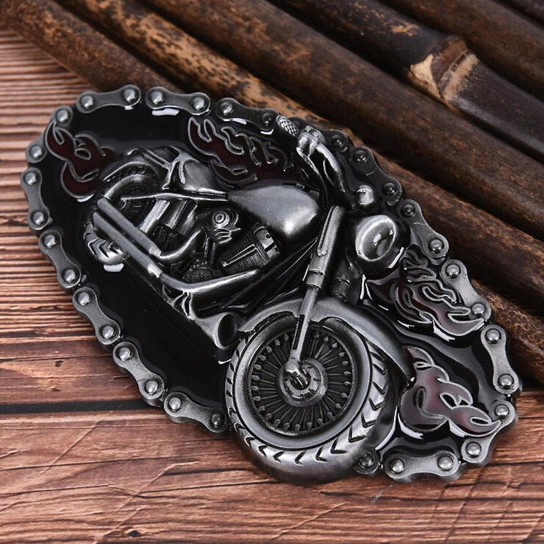 Detailed view of motorcycle-themed metal belt buckle highlighting 3D embossed design, chain detailing, and dark metallic patina