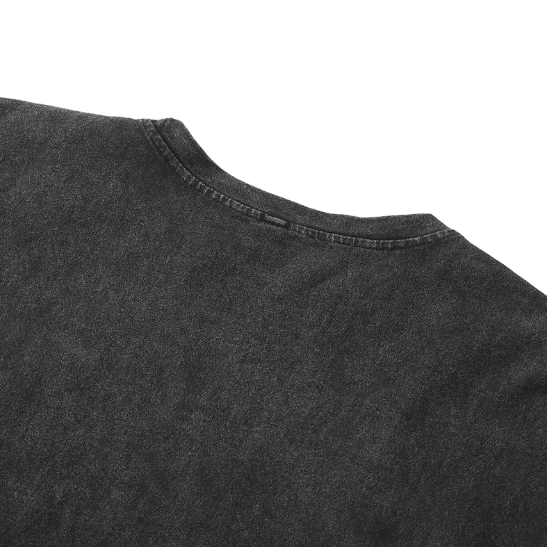 Detail of left shoulder seam stitching on faded black gothic anime distressed tank top