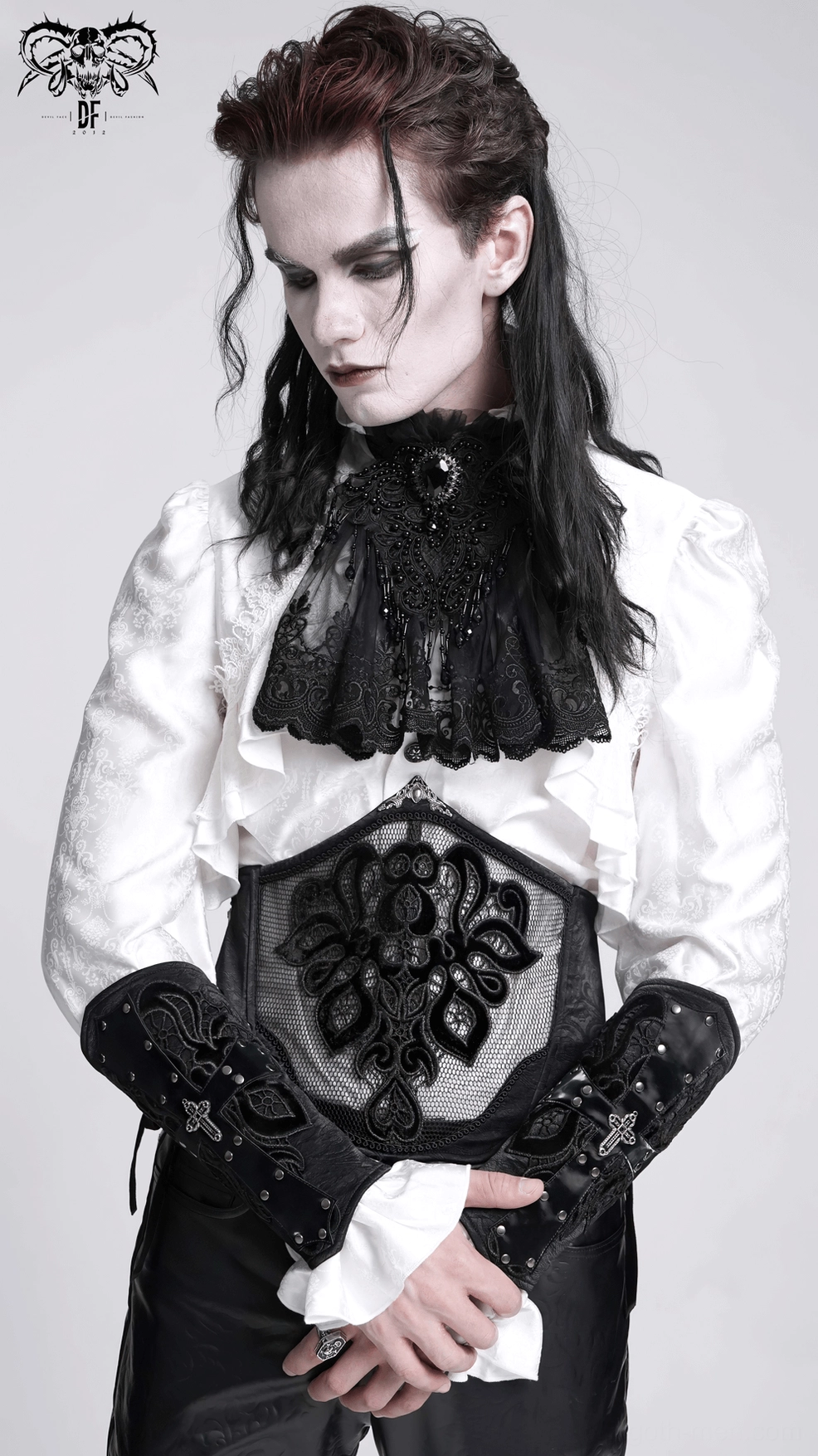Close-up of black gothic arm guard showing embossed texture, metal eyelet precision, and industrial goth design
