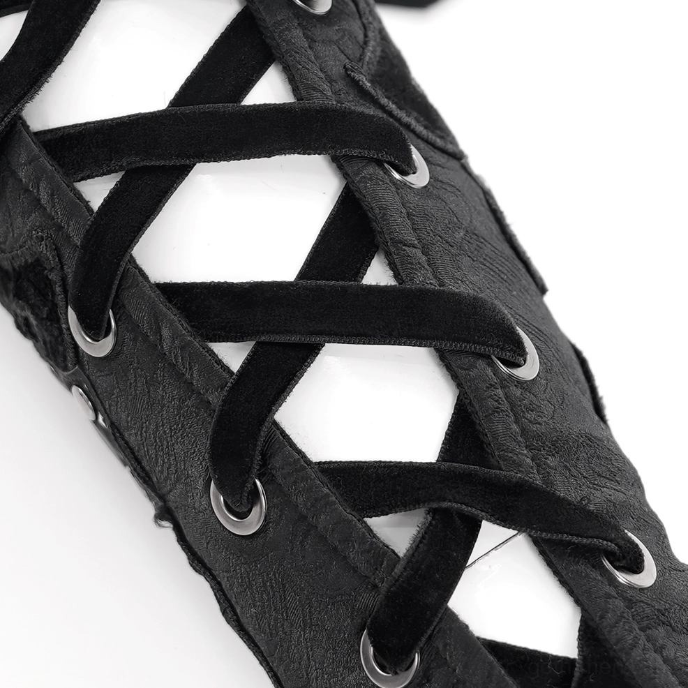 Side close-up detail of gothic arm guard lace-up fastening with velvet lace straps and metal grommets