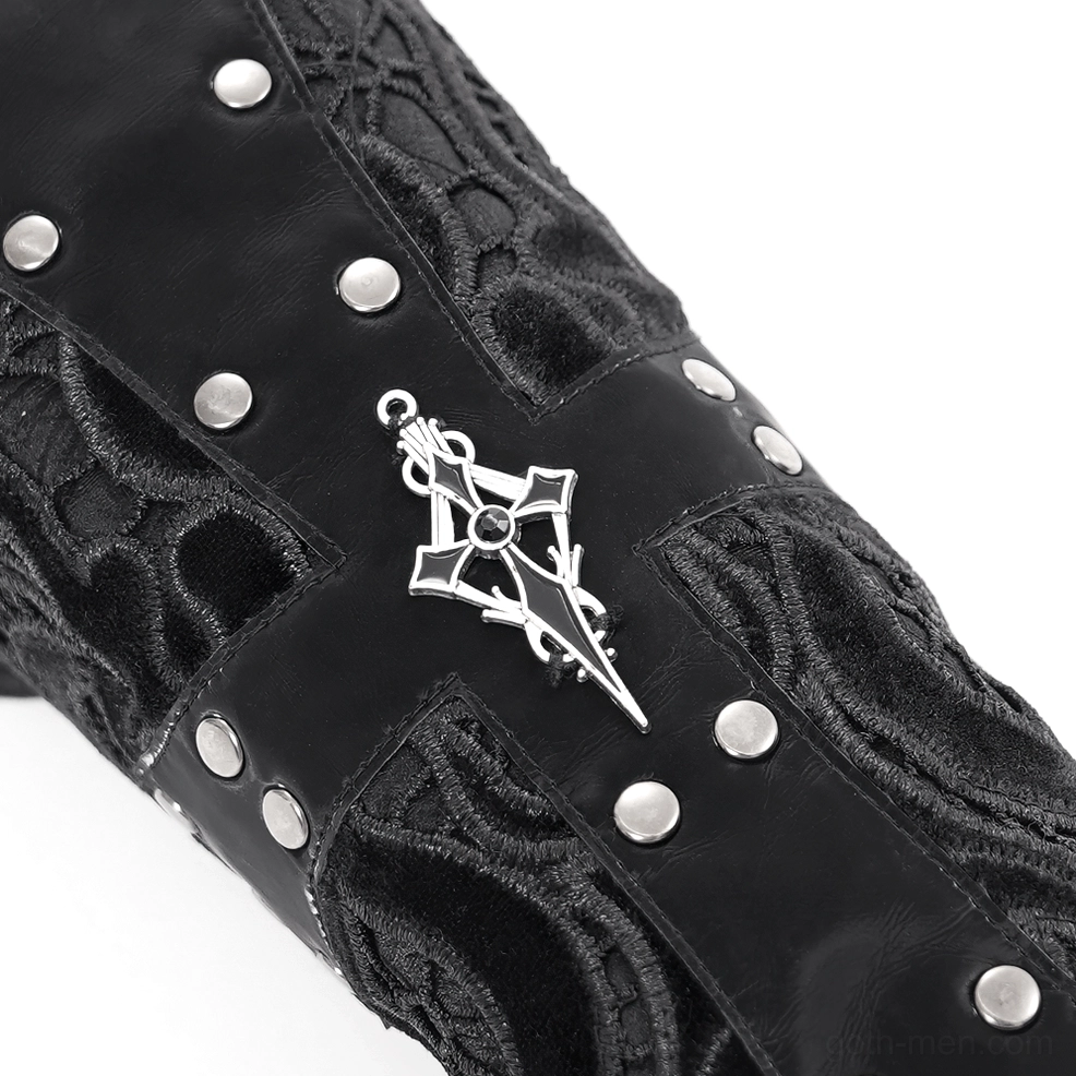 Flat close-up view of black gothic arm guard showing round rivets, cross ornament, and matte leather finish