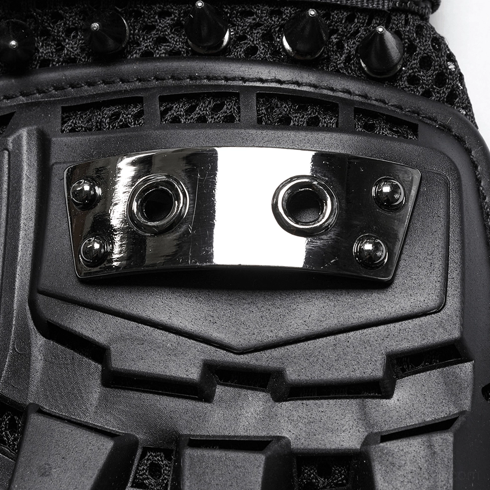 Extreme close-up of gothic glove armor plate, showing dual metal grommets and matte black hard plastic shell