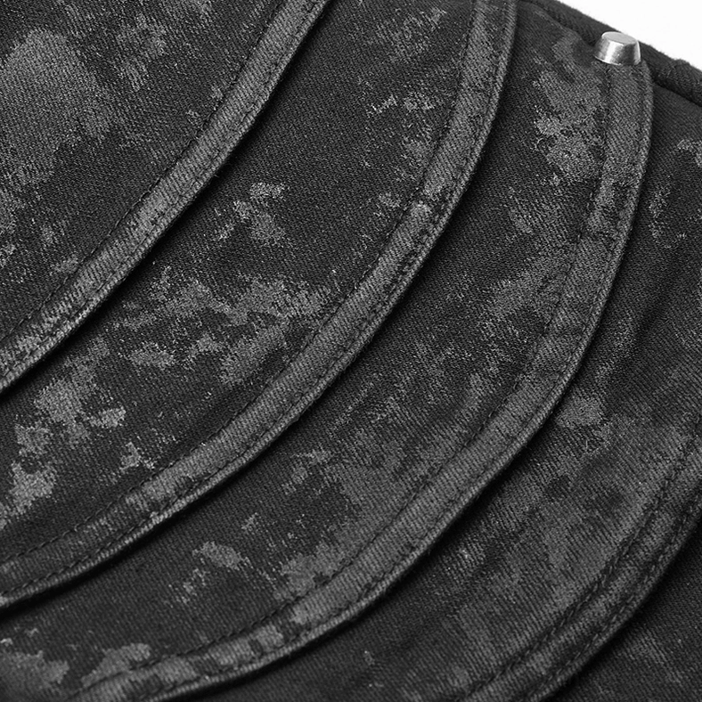 Black distressed denim fabric texture detail showing water-washed rubber coating finish