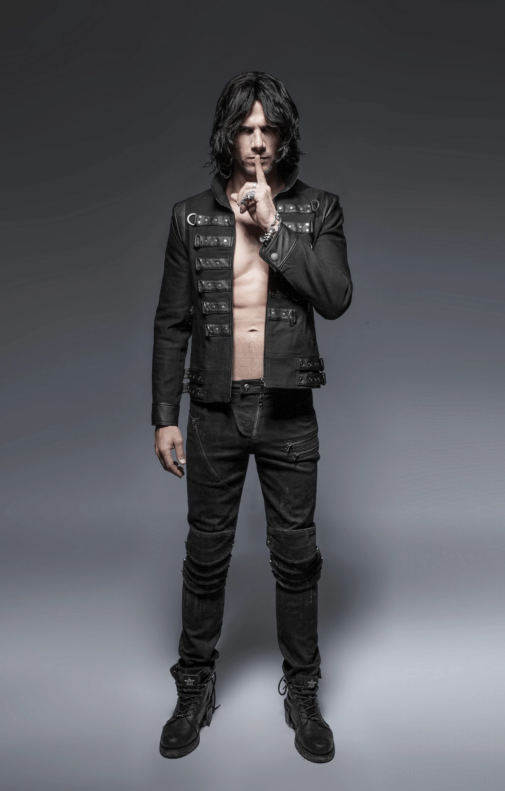 Layered knee armor pad detail on black gothic distressed denim jeans - structural view