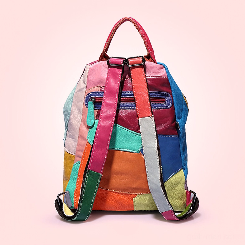 Multicolor patchwork Gothic backpack rear view showing back zipper pocket and shoulder straps