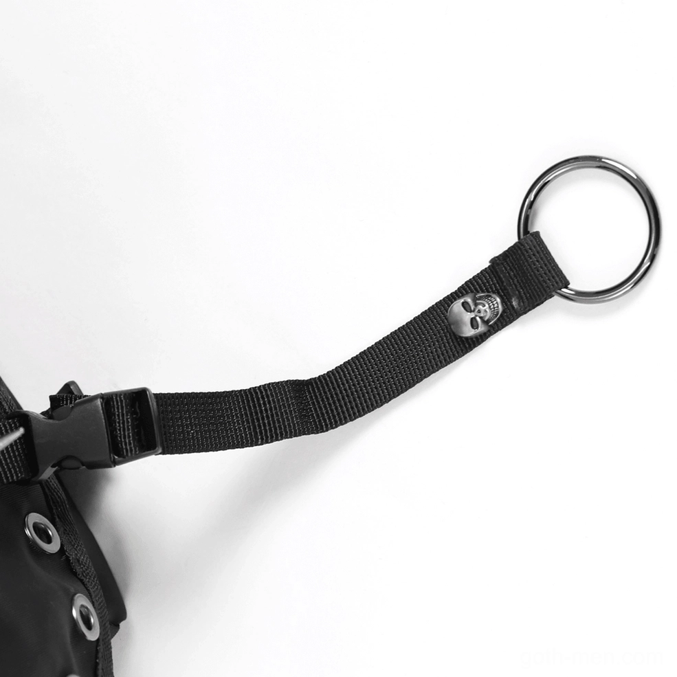 Base and hanging loop details of black gothic crossbody bag with reinforced D-rings