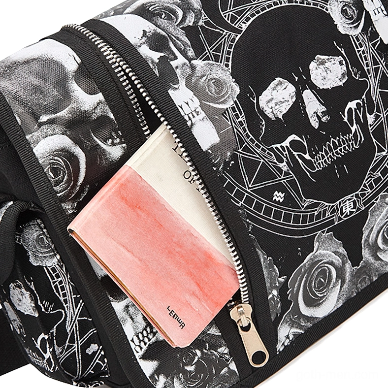 Close-up side view of gothic bag metal zipper on skull print canvas, detail shot of hardware and craftsmanship