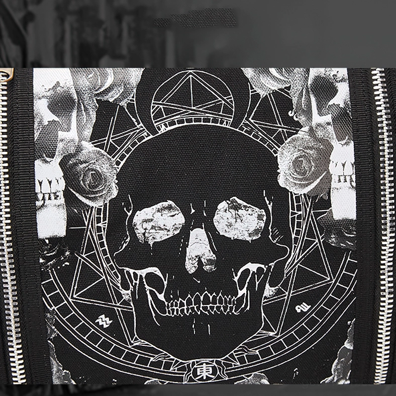 Detailed close-up of skull pentagram rose print pattern on black gothic canvas bag, metal zipper trim detail