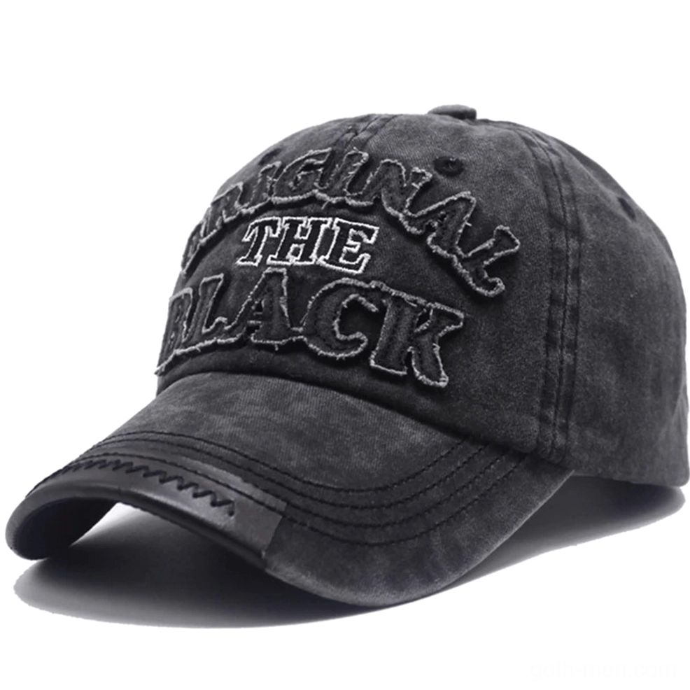 Monochrome dark grey washed gothic baseball cap with leather-like brim accent and embroidered letter logo