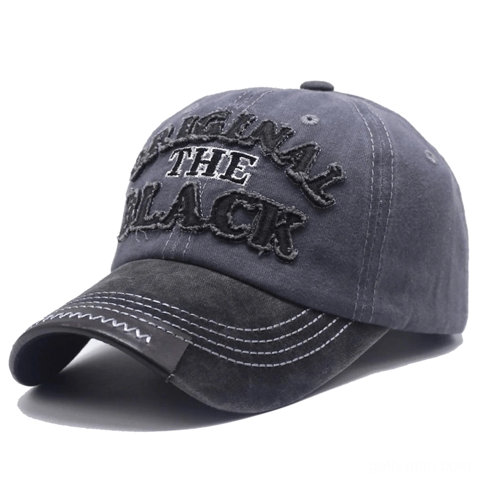 Two-tone grey washed gothic baseball cap with leather-like brim accent and embroidered letter logo