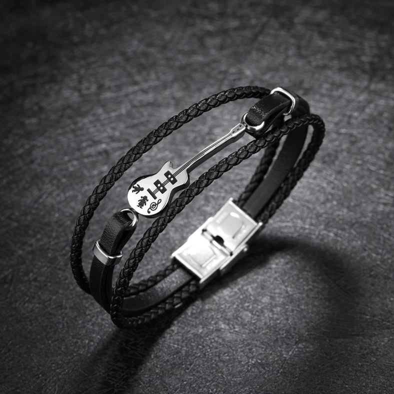 Bass guitar charm woven rope leather bracelet with stainless steel metal ornament on dark background – gothic rock jewelry