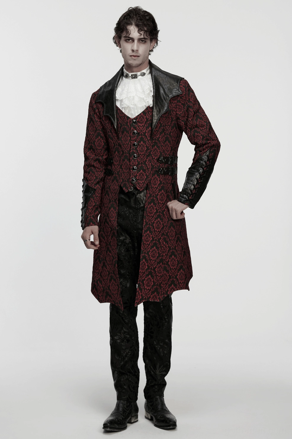 Styled gothic coat showing bat collar influence and leather trim accents in alternative fashion context