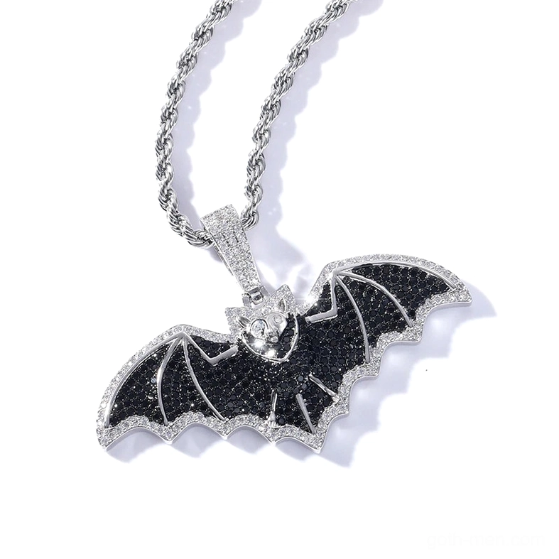 Gothic black cubic zirconia bat pendant necklace with silver finish and pavé stone wing details, overhead view showing intricate gem setting