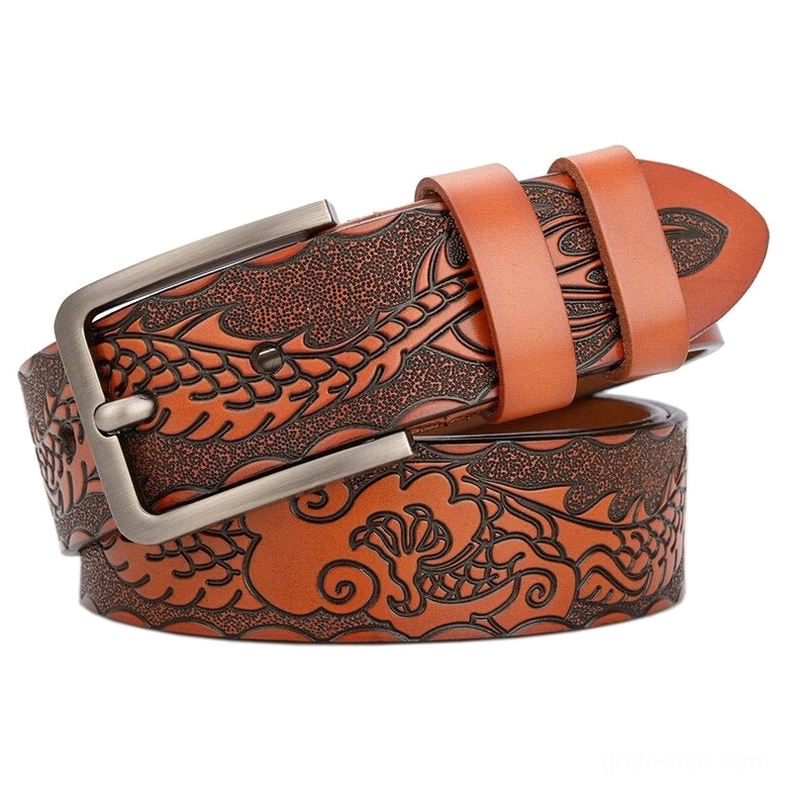 Golden yellow-brown gothic leather belt with embossed floral motifs and silver hardware accent