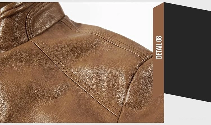 Silver metal zipper hardware close-up on gothic moto jacket brown faux leather surface