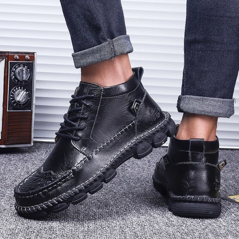 Black gothic ankle boots rear on-foot view - showing thick rubber outsole and heel construction detail