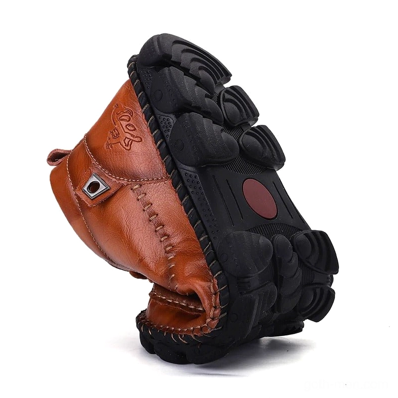 Gothic split leather boot overhead angled view - showing rugged black rubber outsole and sole construction