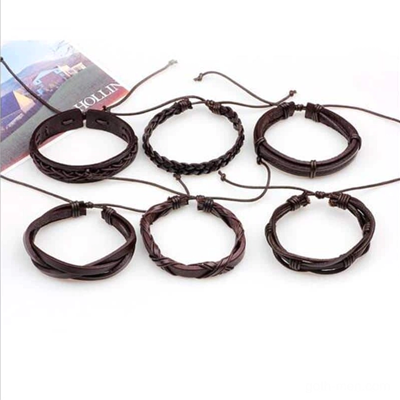 Complete collection of 6 brown leather braided gothic bracelets with adjustable rope closures arranged with magazine styling