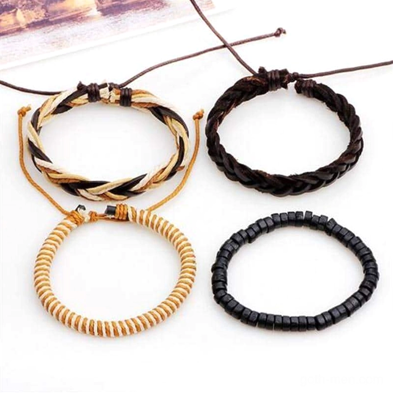 Separate gothic bracelet pieces flat lay showing 4-piece collection with adjustable pull cord closures and dark brown leather