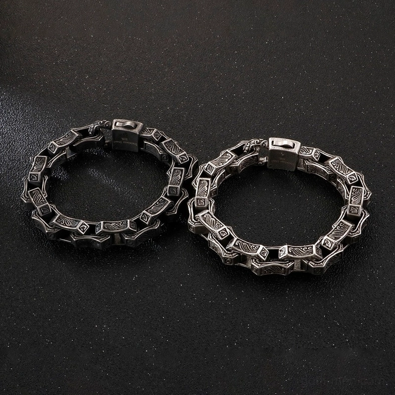 Pair of gothic engraved bracelets blackened and silver finish comparison