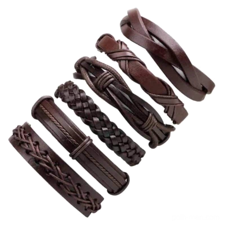 Angled flat lay of 6-piece brown leather gothic bracelet set showing all designs and braided rope textures