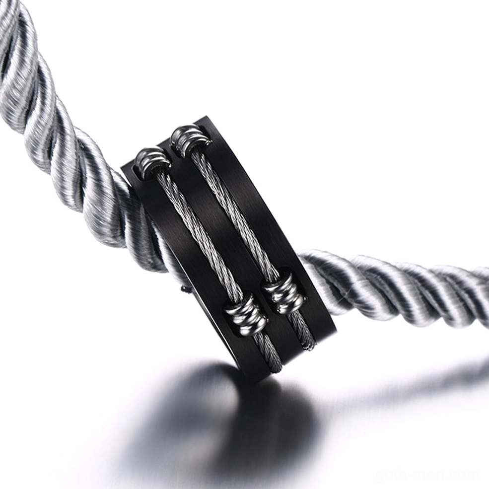 Close-up side view of stainless steel cable ring showing twisted wire embedded design