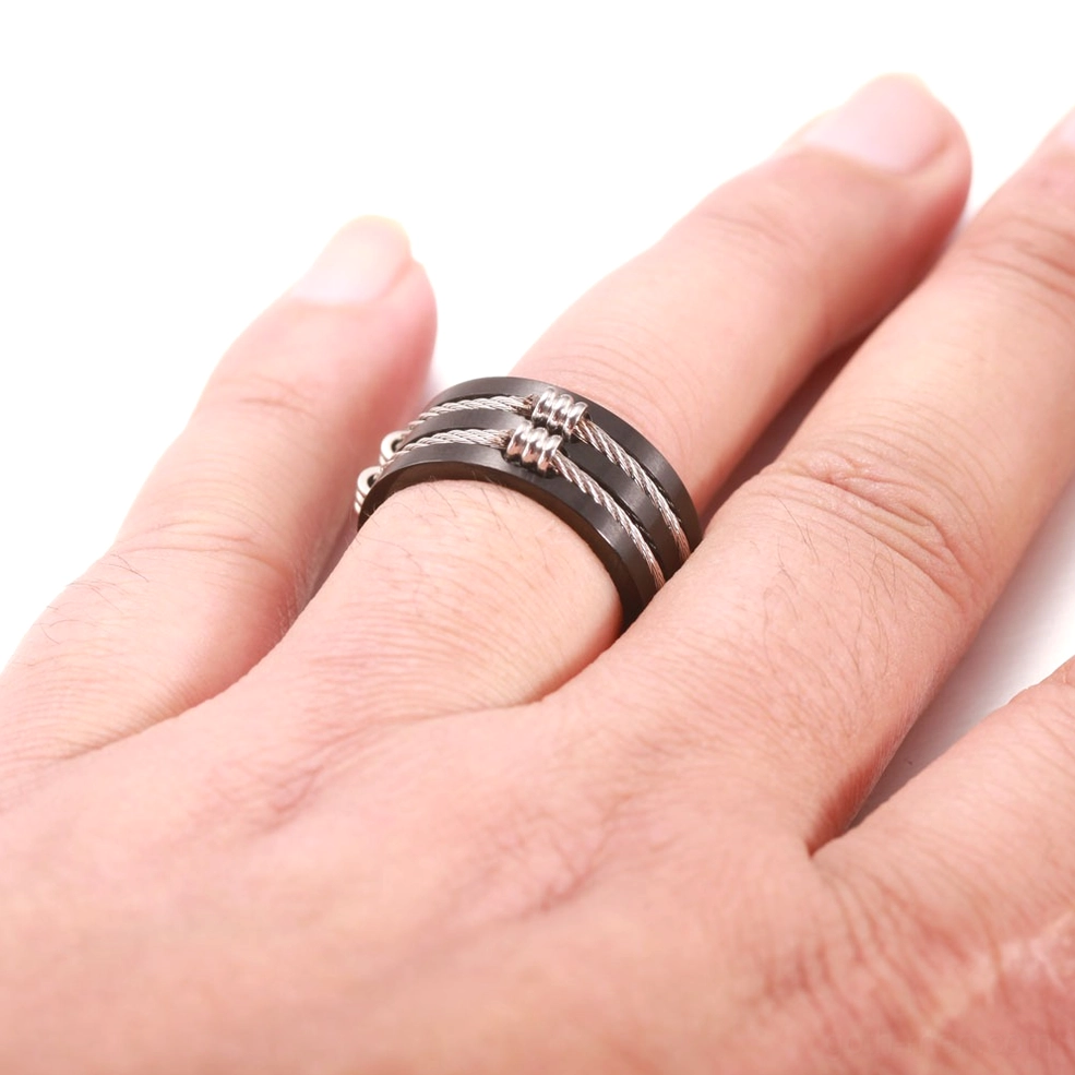 Men's alternative stainless steel gothic ring worn on male model's index finger demonstrating fit
