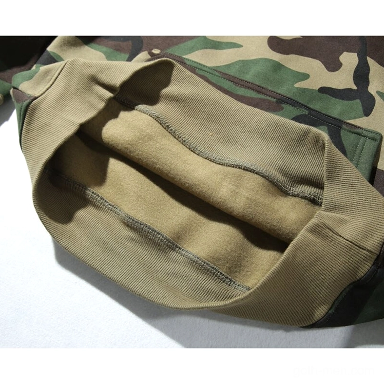 Large kangaroo pouch pocket detail with contrasting tan ribbed trim on dark gothic camouflage hoodie