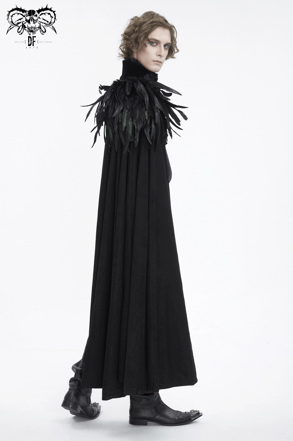 Detailed view of black gothic feathered cape showing asymmetric design, leather strap construction, and feather accents