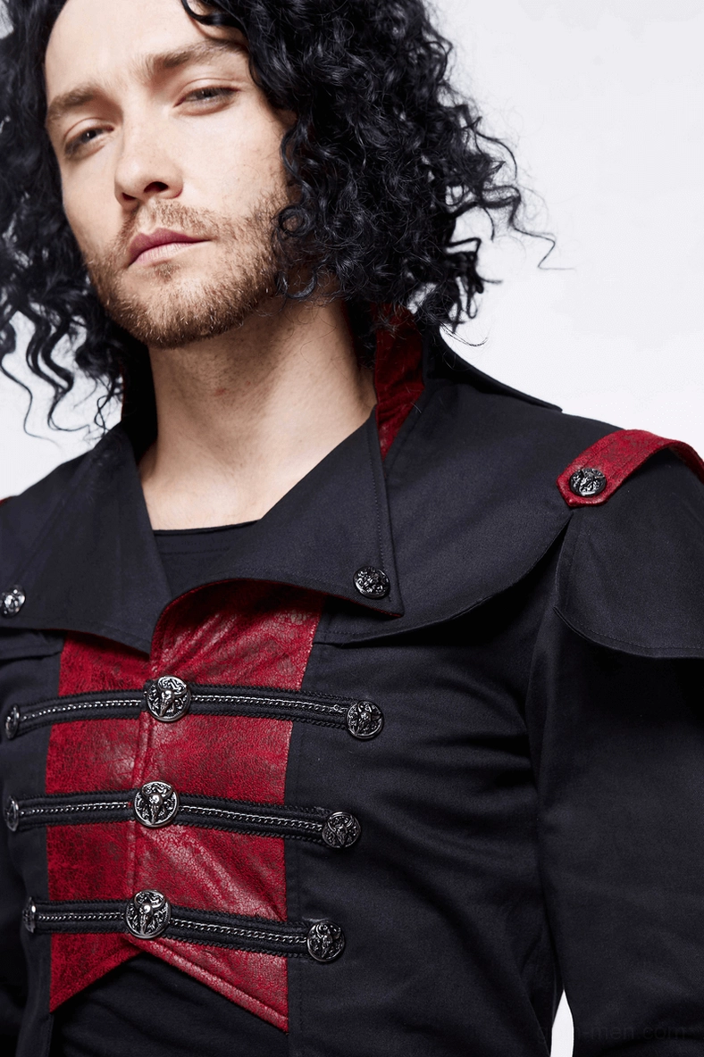 Close-up of gothic military cape coat upper detail on male model showing metal toggle button closure and stand collar design