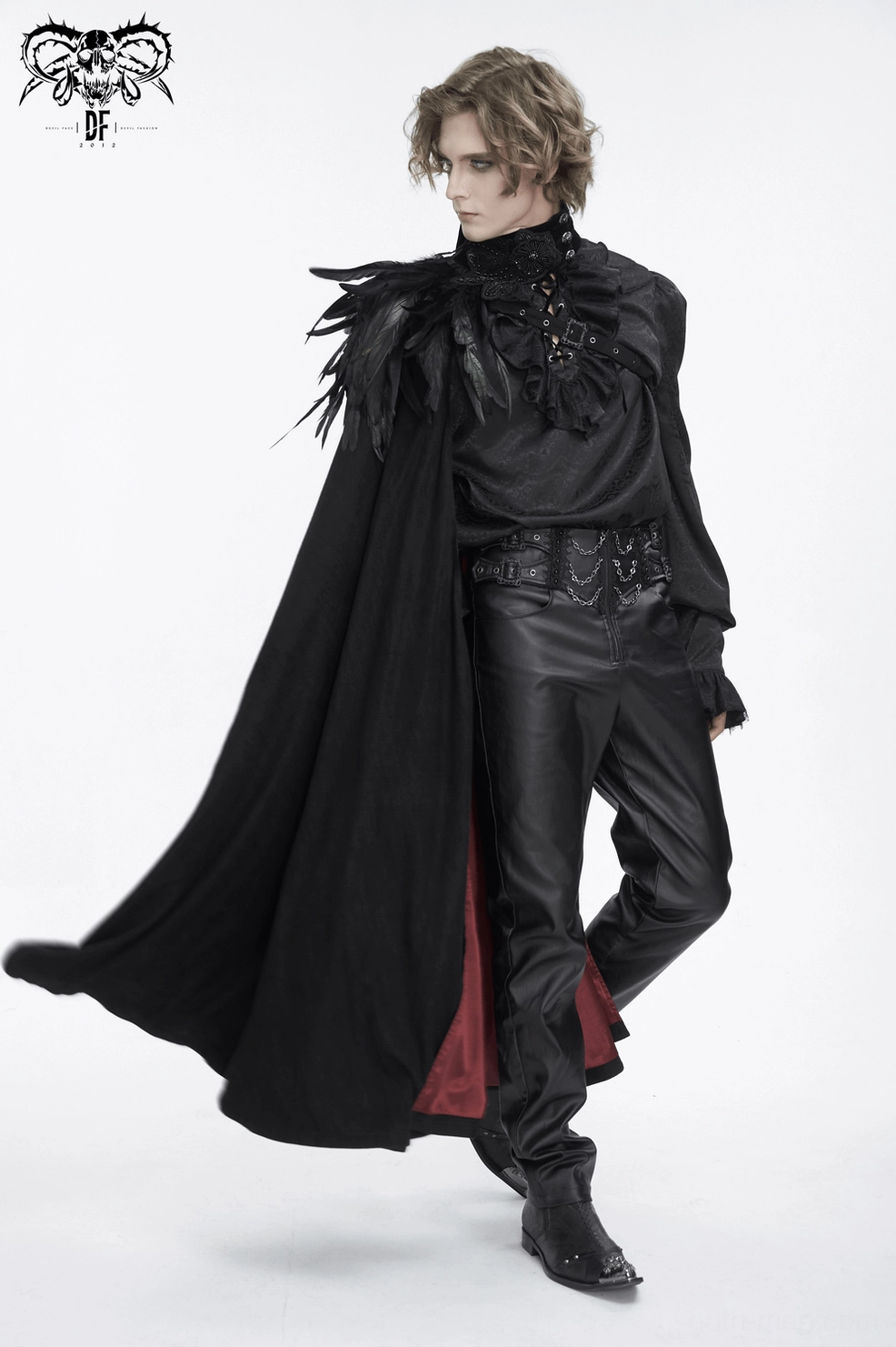 Detail photograph of black feathered gothic cape focusing on feather quality, texture, and placement on collar area