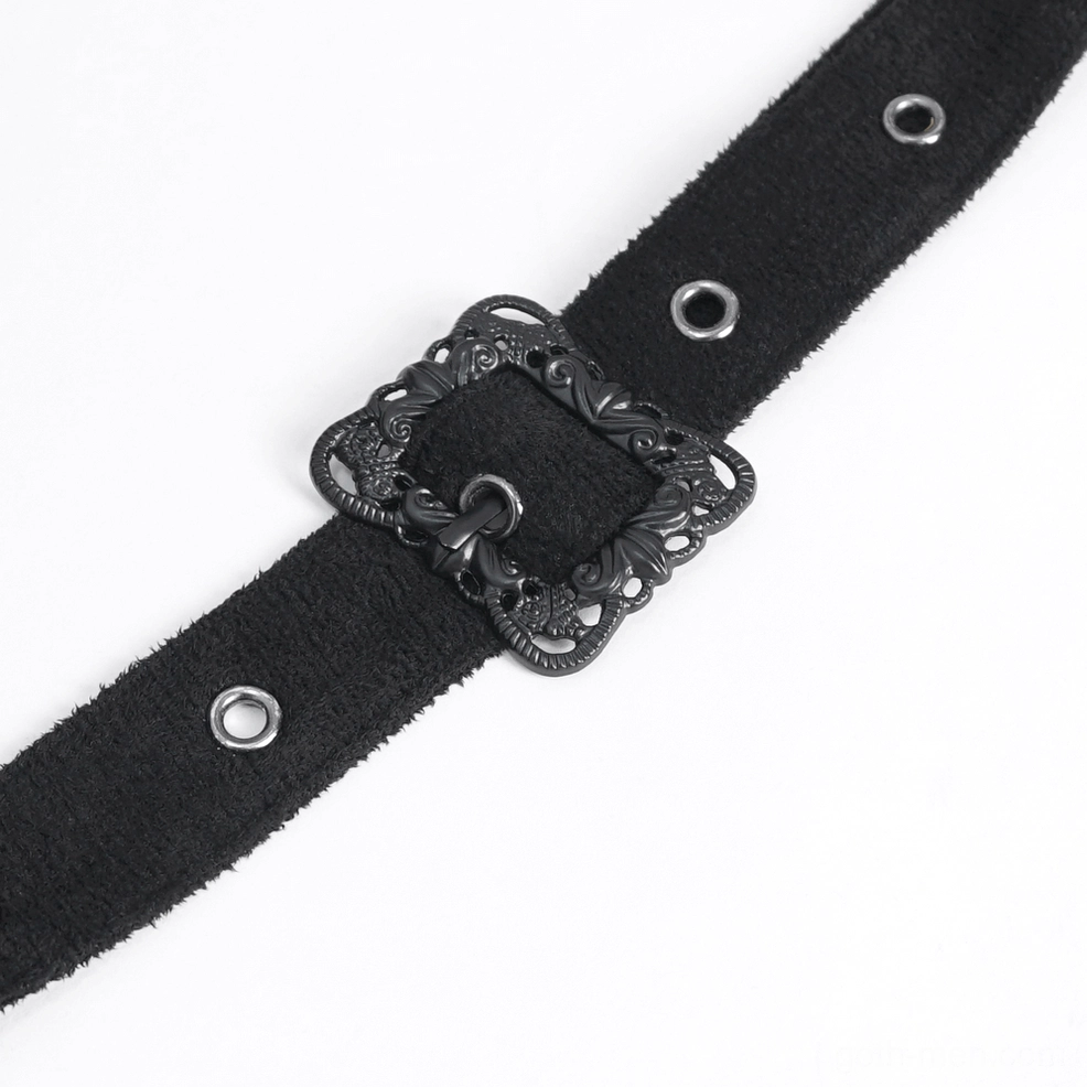 Detail shot of gothic cape leather shoulder strap featuring ornate vintage metal buckle, suede construction, and metal eyelet hardware