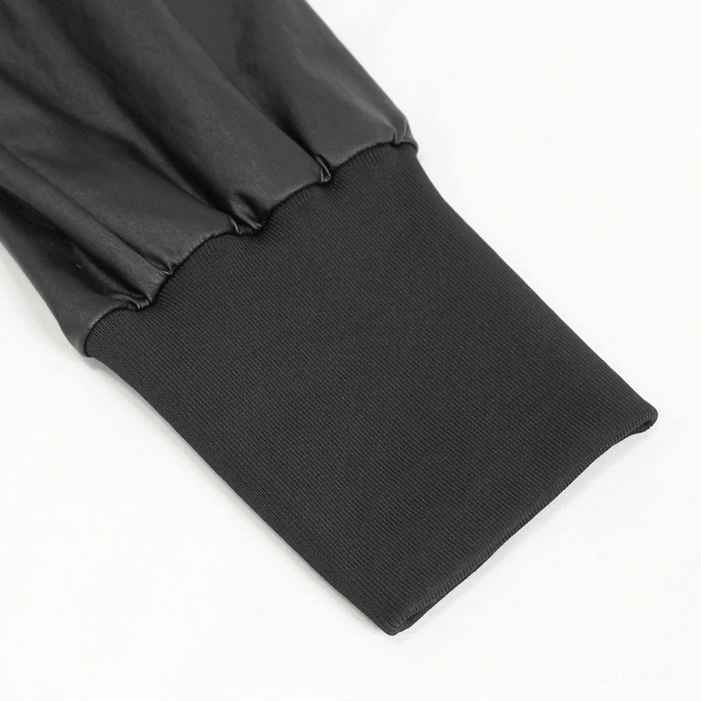 Close-up detail of black gothic cargo joggers ankle cuff showing ribbed knit and faux leather splice