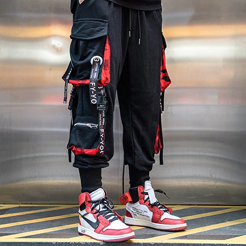 Black gothic cargo joggers product shot showcasing complete design with all multi-pocket details and decorative strap accents