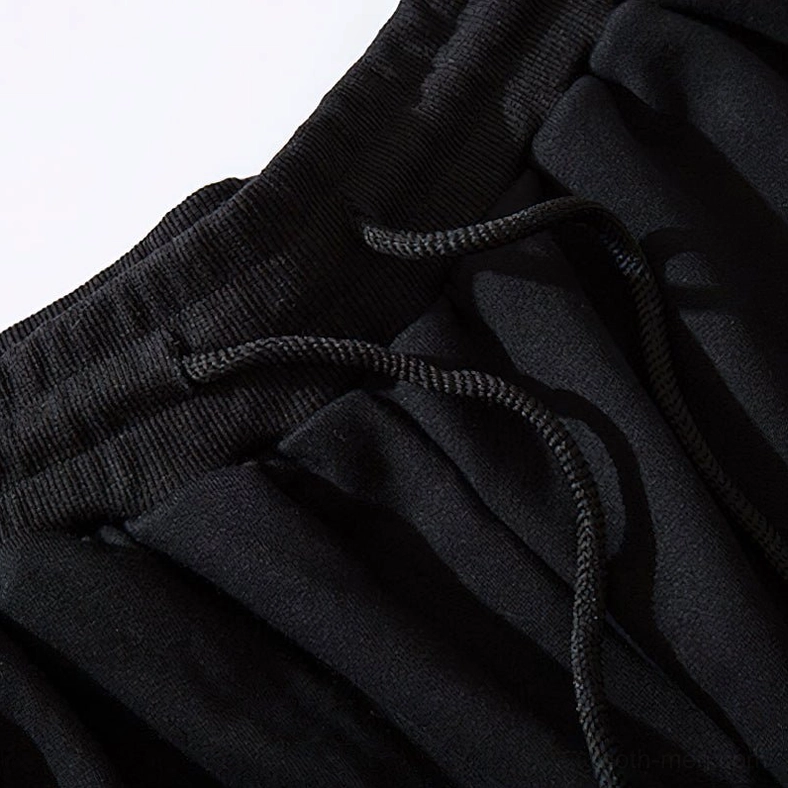 Macro detail of black gothic cargo joggers ribbed waistband with elastic construction and drawstring cord